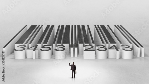 Young businessman standing in front of a big codebar photo