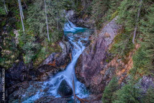 Beautiful waterfall in the mountains with several stairs, Poland Wodogrzmoty Mickiewicz photo