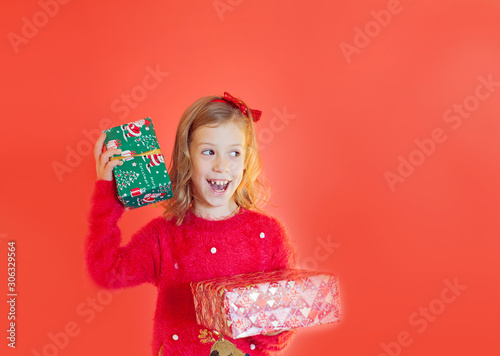 Happy girl  on the red background. Merry Christmas. Sale. Black Friday.