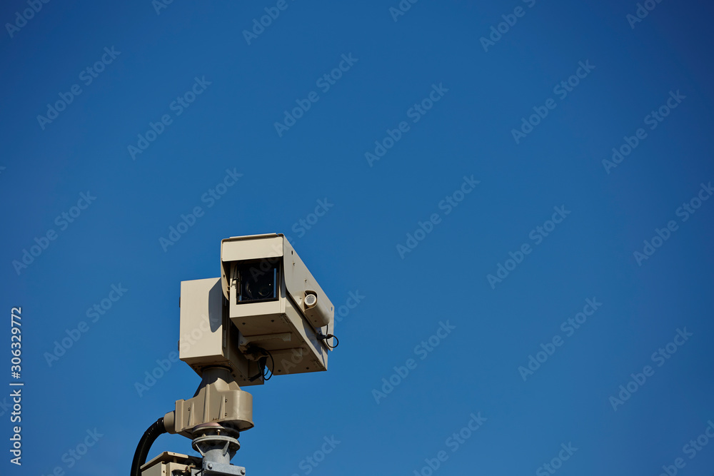 CCTV camera on blue sky background 
