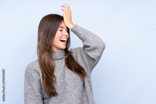 Teenager Brazilian girl over isolated blue background has realized something and intending the solution