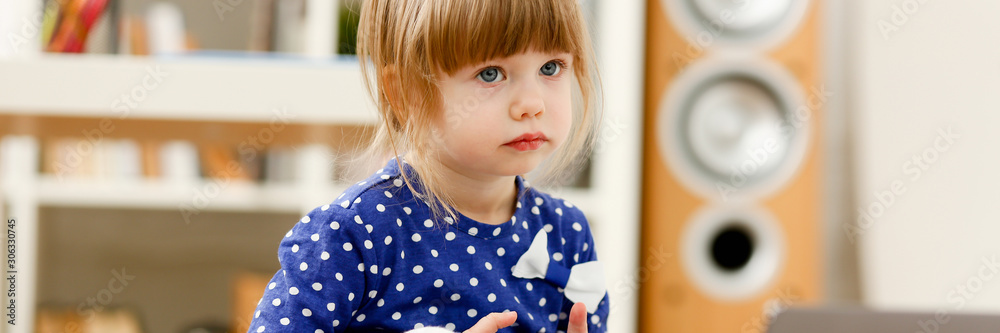Cute little girl on floor carpet use cellphone