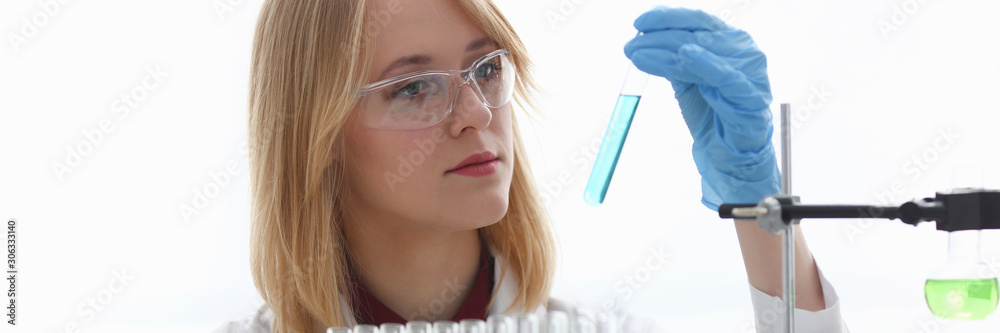 Technician hold in arms in protective gloves Technician hold in arms in protective gloves