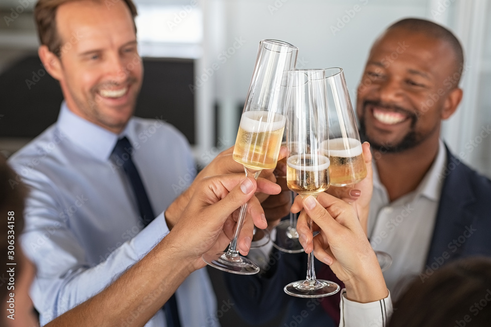 Business people raising toast at office Business people raising toast at office