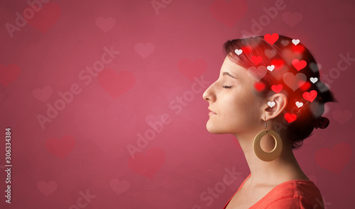 Head with full of love, red background and hearts photo