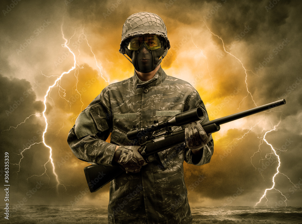 Armed soldier standing in rainy obscure weather Armed soldier standing in rainy obscure weather