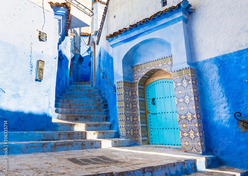 Traditional blue door in Chefchaouen city n Morocco with beautiful light