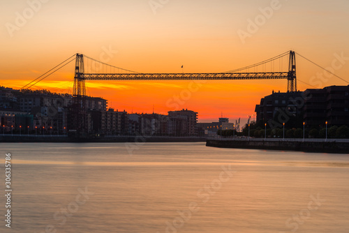 Panorama of Portugalete and Getxo with Hanging Bridge of Bizkaia at dusk from La Benedicta pier, Basque Country, Spain photo