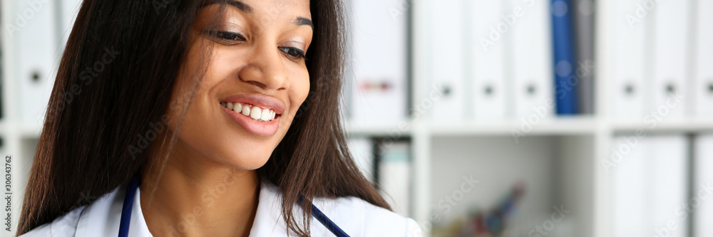 Beautiful black smiling female doctor portrait Beautiful black smiling female doctor portrait