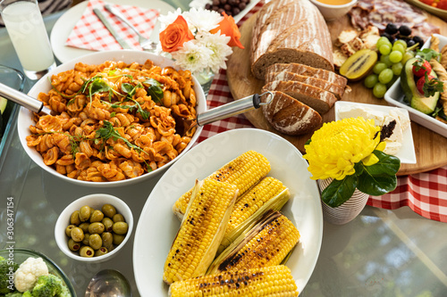 Food on an outdoor dinner table photo