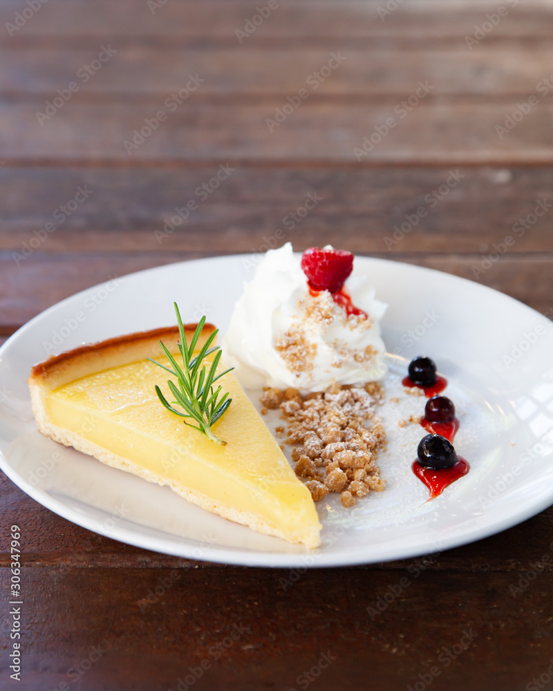 Fresh tasty lemon tart with crumble and whipped cream Fresh tasty lemon tart with crumble and whipped cream