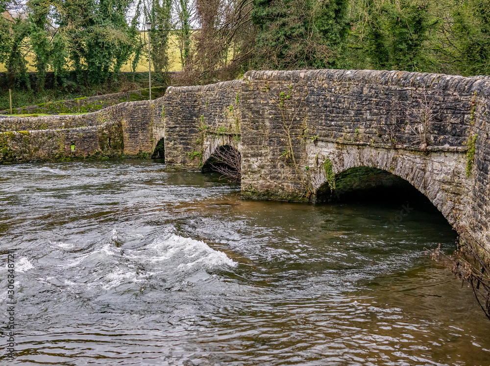 Fototapeta premium Sheepwash Bridge over the River Wye, Ashford in the Water, Derbyshire. Claimed to be the most photographed bridge in the UK