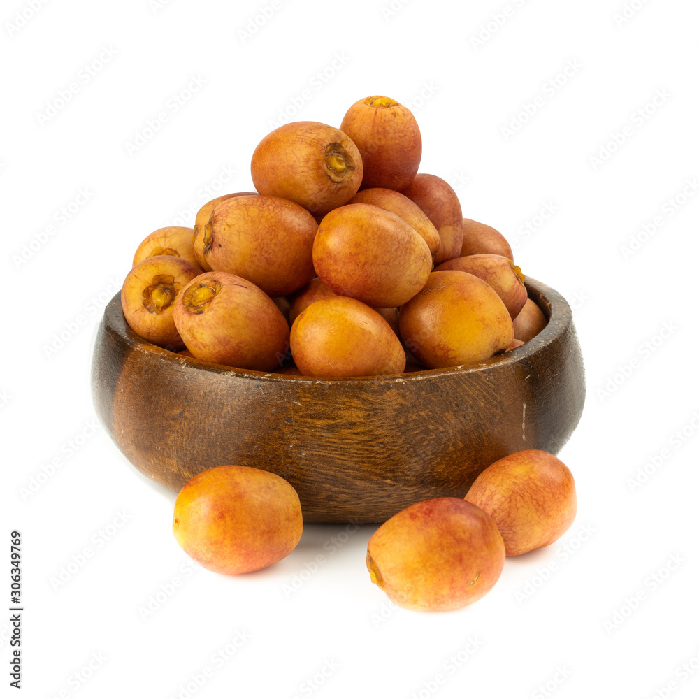 Bunch of yellow raw Date Fruit or Medjool Dates (Phoenix dactylifera) from the palm tree isolated on White Background.Healthy lifestyle and Vegetarian concept Bunch of yellow raw Date Fruit or Medjool Dates (Phoenix dactylifera) from the palm tree isolated on White Background.Healthy lifestyle and Vegetarian concept