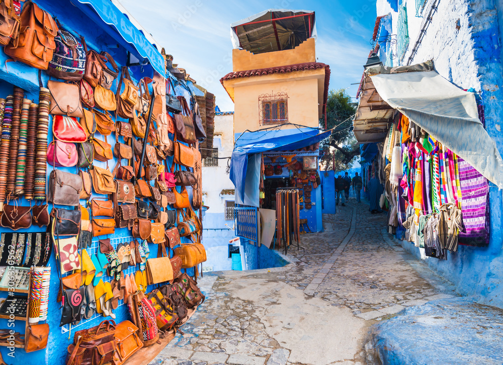 Traditional bags, carpets and handicrafts on the street of Chefchaouen, Morocco