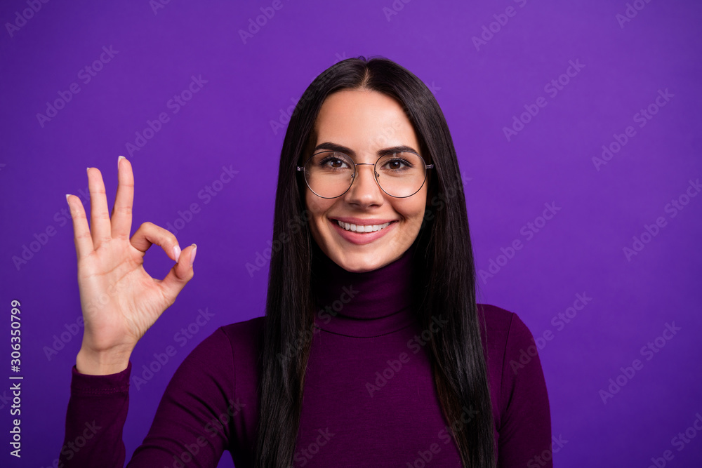 Close up photo of cheerful positive attractive woman smile toothy showing ok sign isolated bright color purple background Close up photo of cheerful positive attractive woman smile toothy showing ok sign isolated bright color purple background