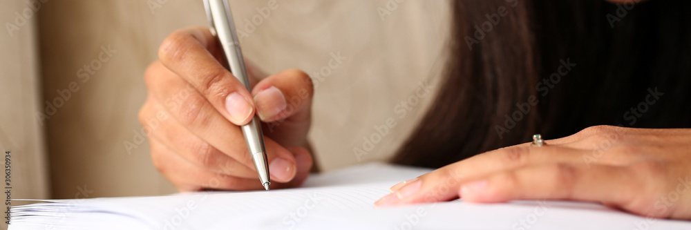 Arm of black woman write story in notebook Arm of black woman write story in notebook