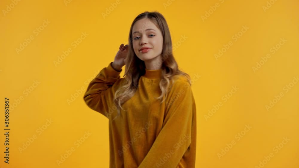 smiling teenager dancing isolated on yellow smiling teenager dancing isolated on yellow