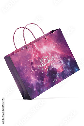 Subject shot of a gift bag with silky plaited handles and with pink and violet abstract design with sparkles and a pleasant text: "Perfect time it's now."
