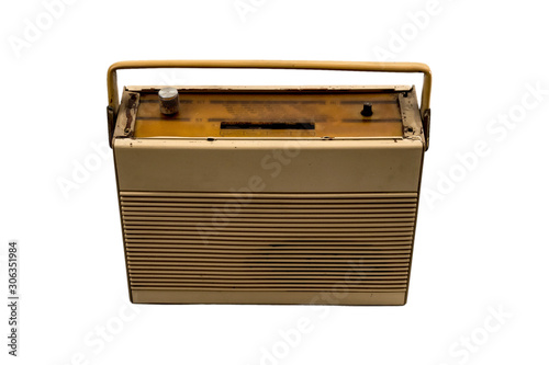 Old transistor radio in brown color isolated on white background