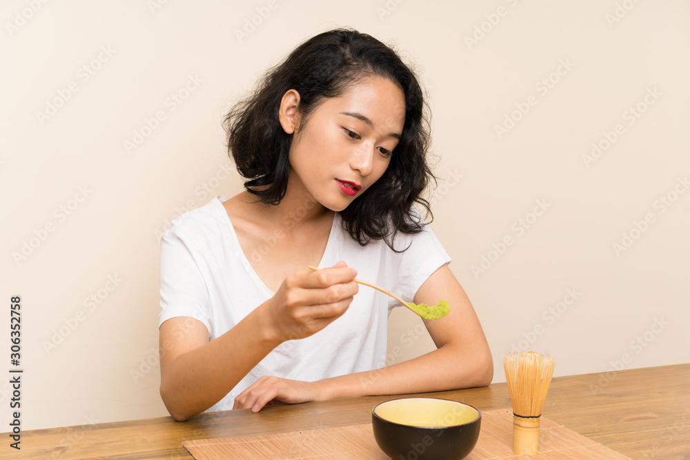Young asian girl with tea matcha Young asian girl with tea matcha