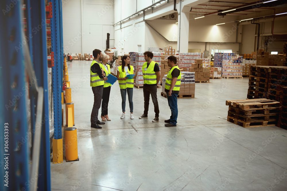 Warehouse meeting, managers and workers