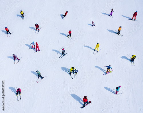 Background of many skiers and snowboarders. Winter sports