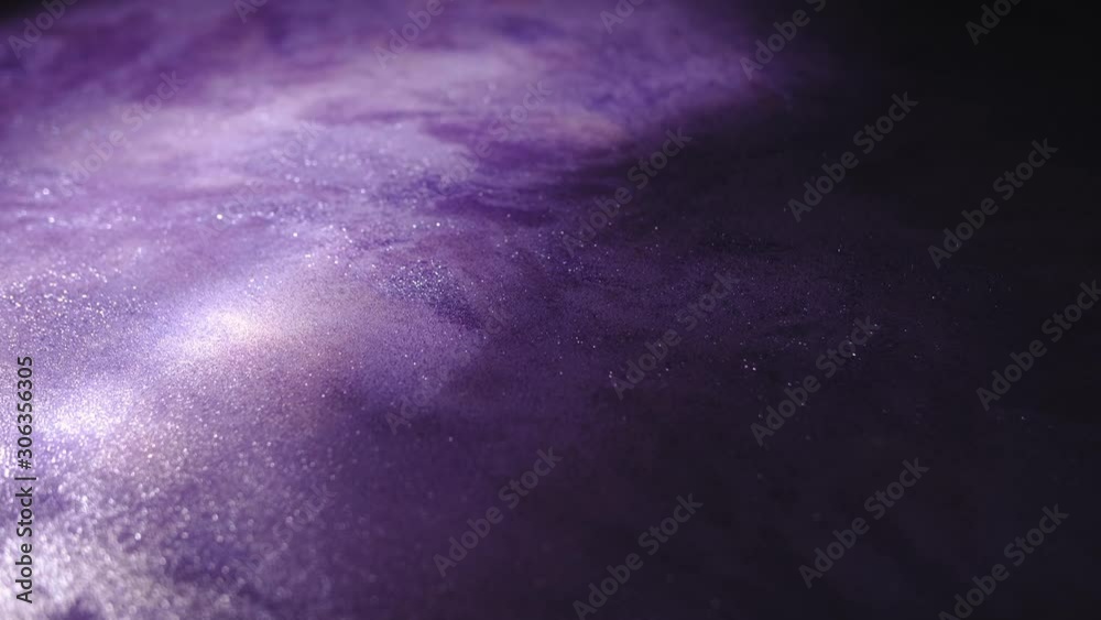 Organic and beautiful textured violet background. Slow rotation with light spots on plain surface. Amethyst color, deep purple, saturated, abstract, colorful and organically painted backdrop.