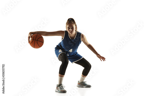 Young caucasian female basketball player of team in action, motion in run isolated on white background. Concept of sport, movement, energy and dynamic, healthy lifestyle. Training, practicing.