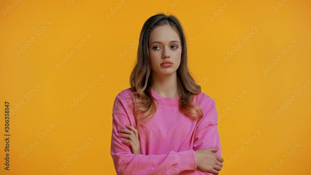 teenager rejecting gift and toy isolated on yellow teenager rejecting gift and toy isolated on yellow