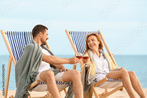 Happy couple drinking wine ...