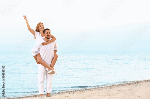 Happy couple resting at sea...