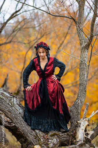 Portrait of a mature lady in a vintage dress  autumn time.