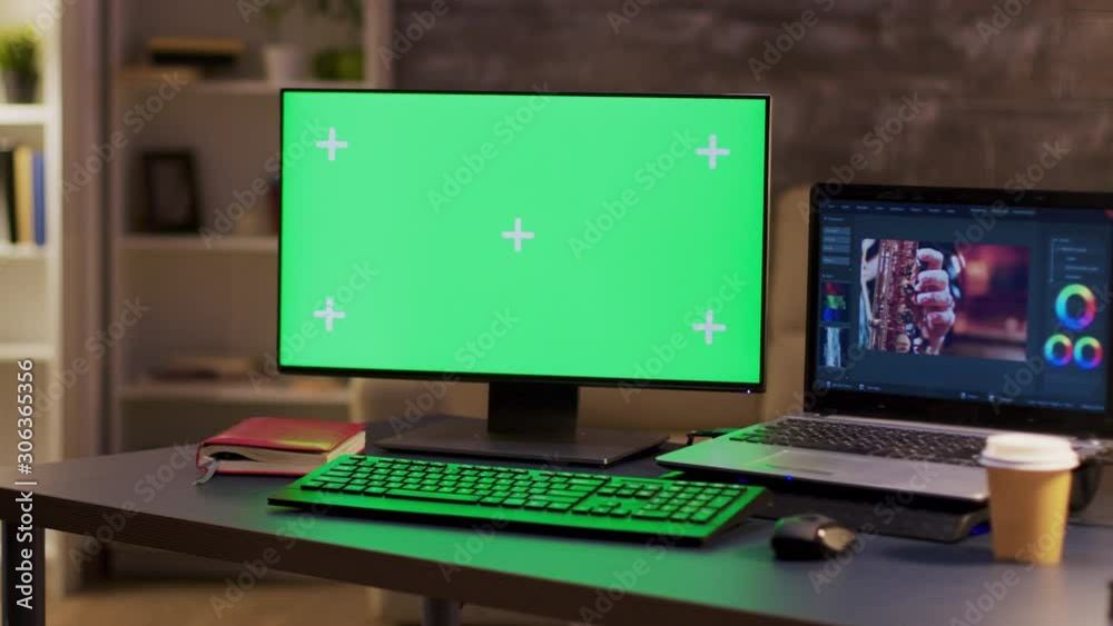 Computer monitor with green screen of a videographer Computer monitor with green screen of a videographer
