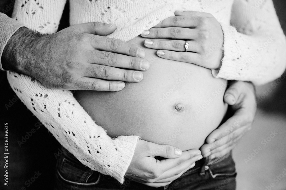 Free Photo  Side view of silhouette of husband man approaching to belly of  pregnant woman in elegant laced bra and panties posing against white  background in studio