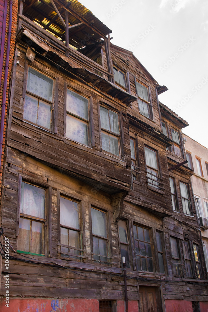 Traditional historic wooden buildings stand semi-derelict in the Zeyrek district of Fatih, Istanbul