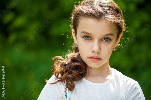 Photography Calm brunette little girl in summer park