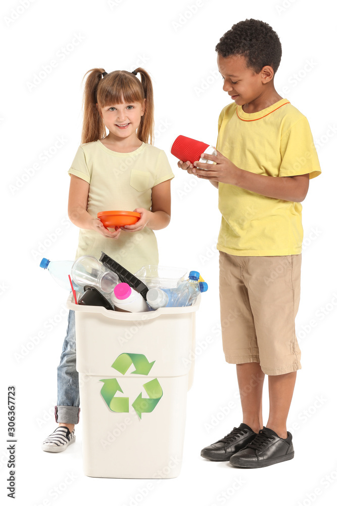 Little children and container with trash on white background. Concept of recycling Little children and container with trash on white background. Concept of recycling