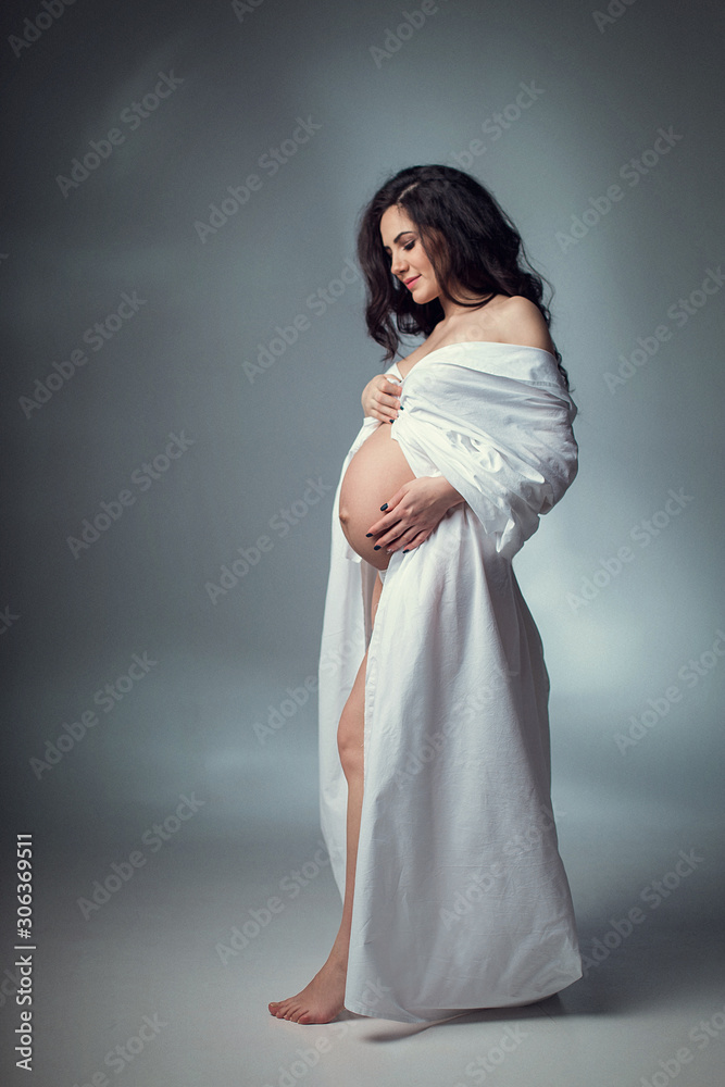 Long Hair Pregnant Nude - pregnant girl naked in sheet young happy 18 years Caucasian ethnicity  brunette long hair art photo studio dark background beautiful, attractive,  smile, art, strip on the tummy gynecology trimestr Stock Photo |