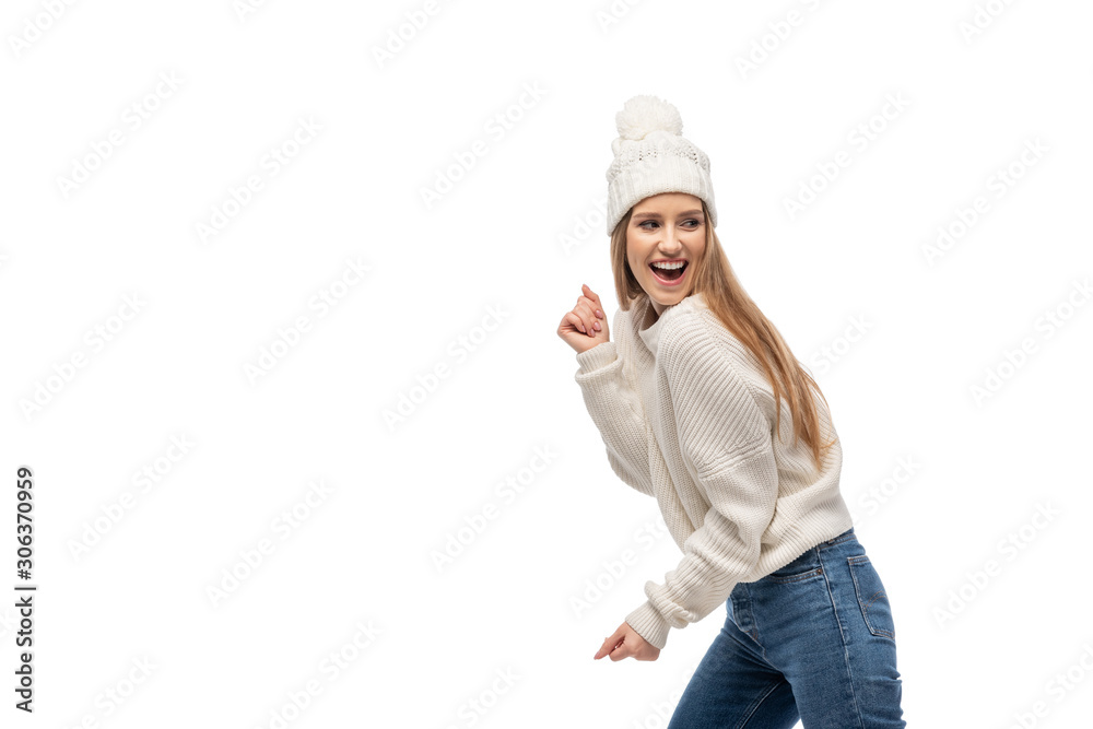 excited woman dancing in white knitted sweater and hat, isolated on white excited woman dancing in white knitted sweater and hat, isolated on white