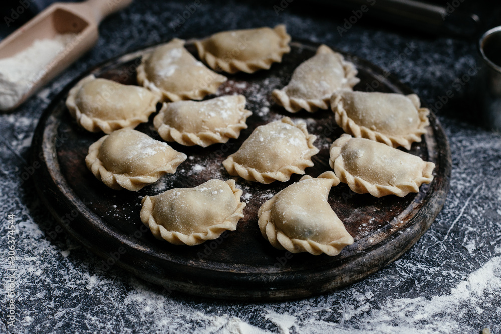 The process of making dumplings, pies in the kitchen The process of making dumplings, pies in the kitchen