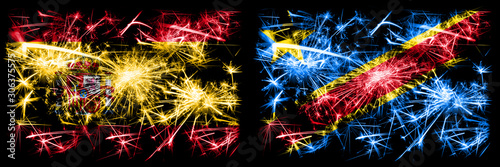 Spanish vs Democratic Republic of the Congo New Year celebration sparkling fireworks flags concept background. Combination of two abstract states flags. © Vlad