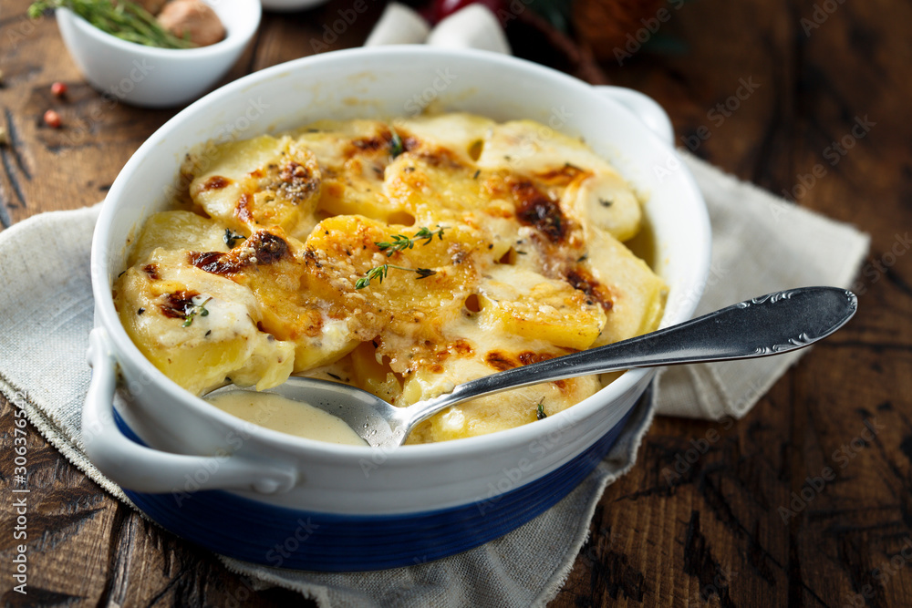 Homemade potato gratin with cream and cheese Homemade potato gratin with cream and cheese