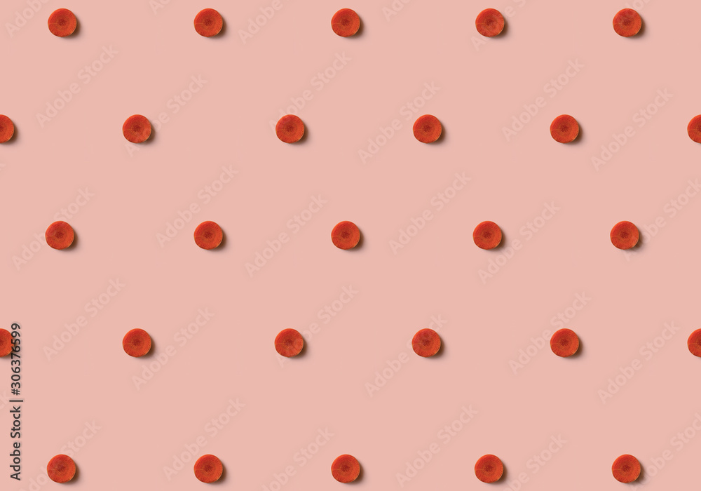 Carrot pattern isolated on soft pink background. Vegetables. Carrot pattern isolated on soft pink background. Vegetables.