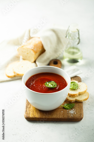 Homemade tomato soup in a white bowl