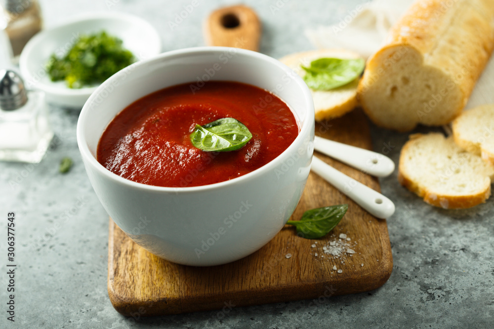 Homemade tomato soup in a white bowl