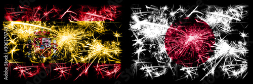 Spanish vs Japan, Japanese New Year celebration sparkling fireworks flags concept background. Combination of two abstract states flags. © Vlad
