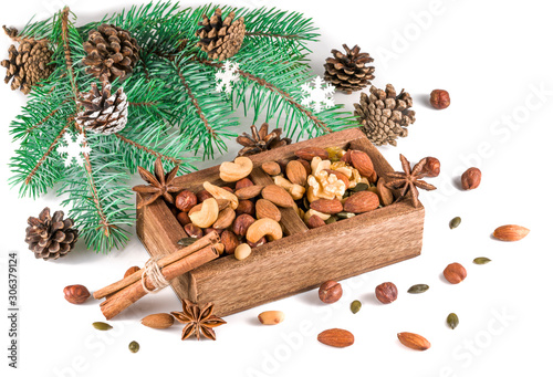 Wooden box with mixed nuts isolated on white. Christmas set.