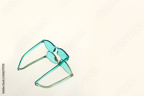 Colorful sunglasses on a table.