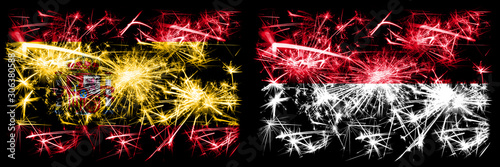 Spanish vs Monaco, Monacan New Year celebration sparkling fireworks flags concept background. Combination of two abstract states flags. © Vlad
