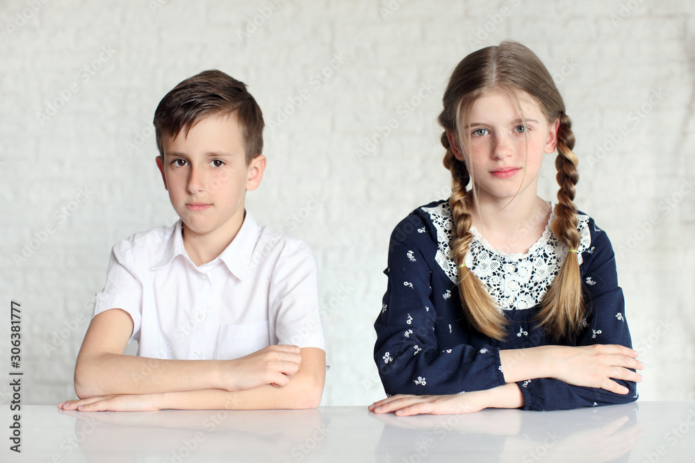 Cute school girl and schoolboy, isolated on white Cute school girl and schoolboy, isolated on white